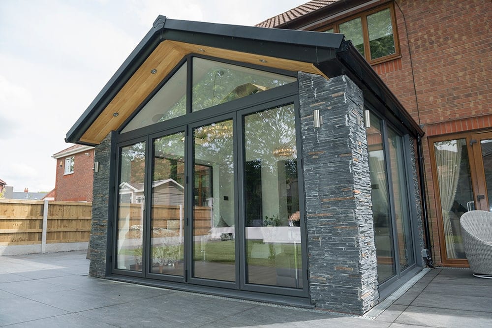 WARMroof stone decorative walls with black roof