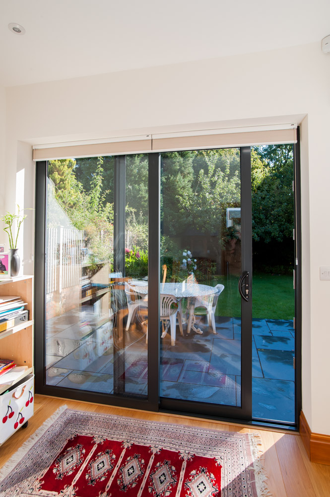 Aluminium Sliding Patio Doors open out to a garden